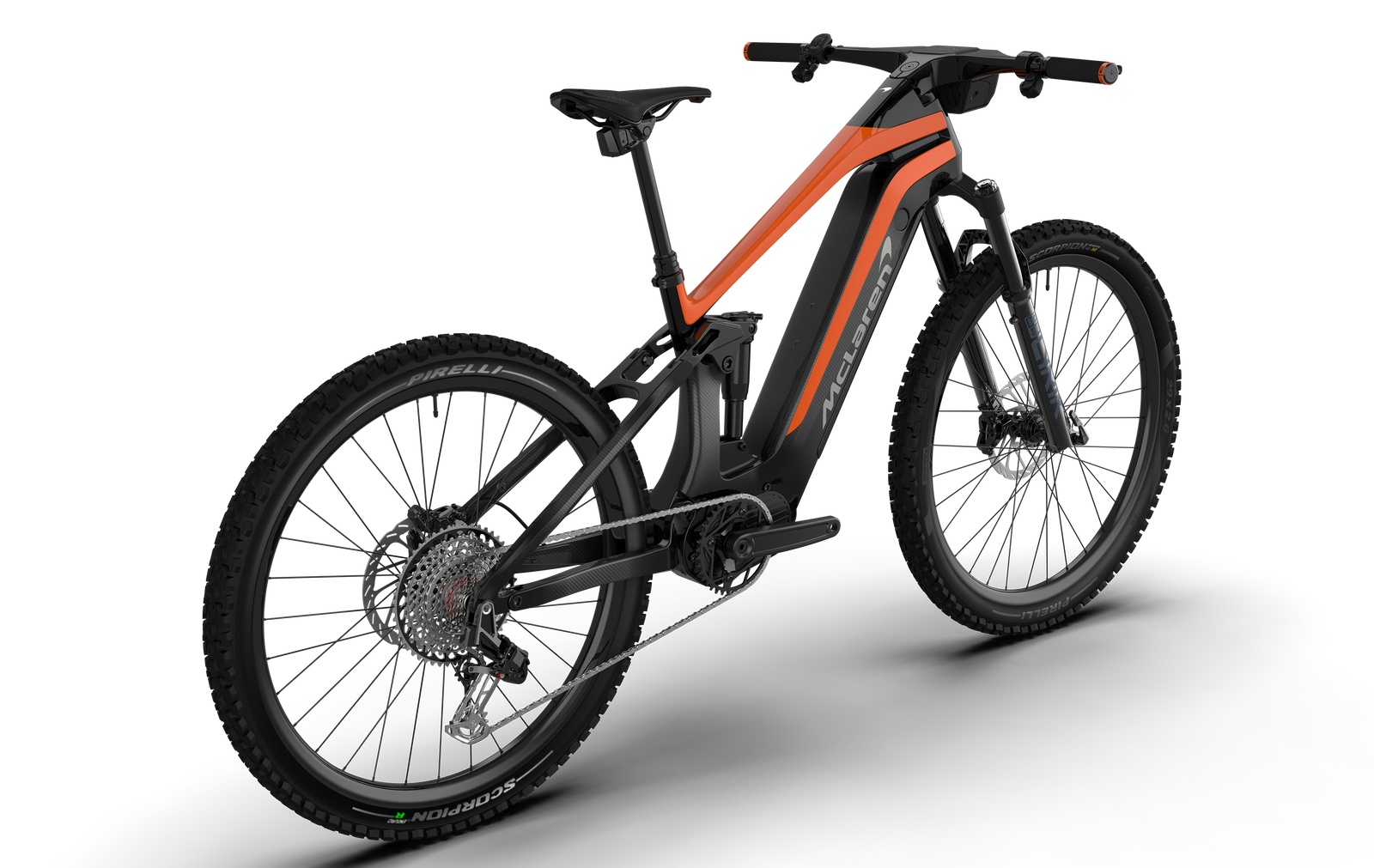 Three-quarter angle view from the rear of the carbon McLaren full suspension eMTB, featuring a 29-inch front wheel and 27.5-inch rear wheel, SRAM Eagle drivetrain and integrated cockpit with high-definition digital display.