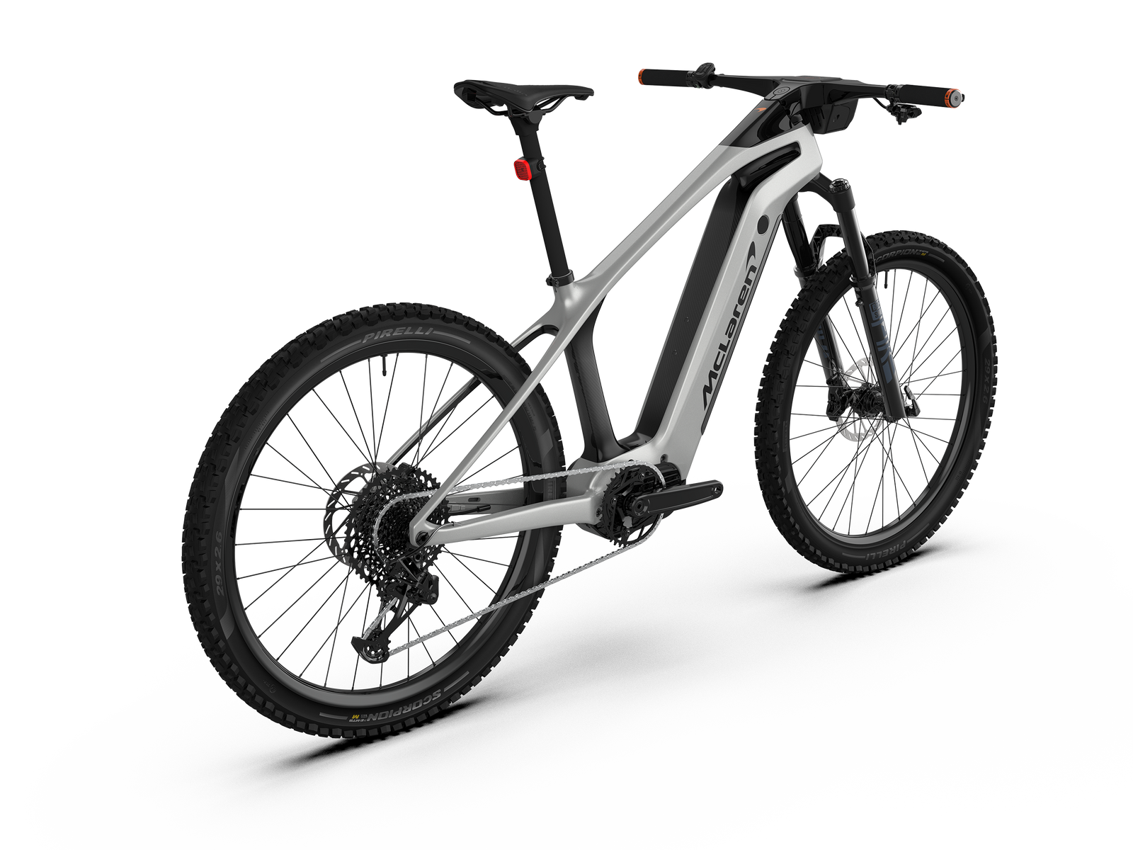 Three-quarter angle view from the rear of the carbon McLaren 29er hardtail electric mountain bike featuring SRAM drivetrain and integrated cockpit with high-definition digital display.